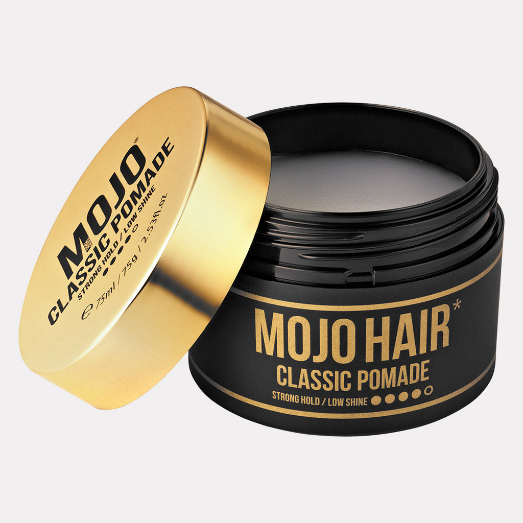 Mojo Hair Classic Pomade Water based Product photographed front on features Gold Lid off and Black tub featuring stylish retro twist design and product benefits of strong hold and low shine revealing contents inside tub