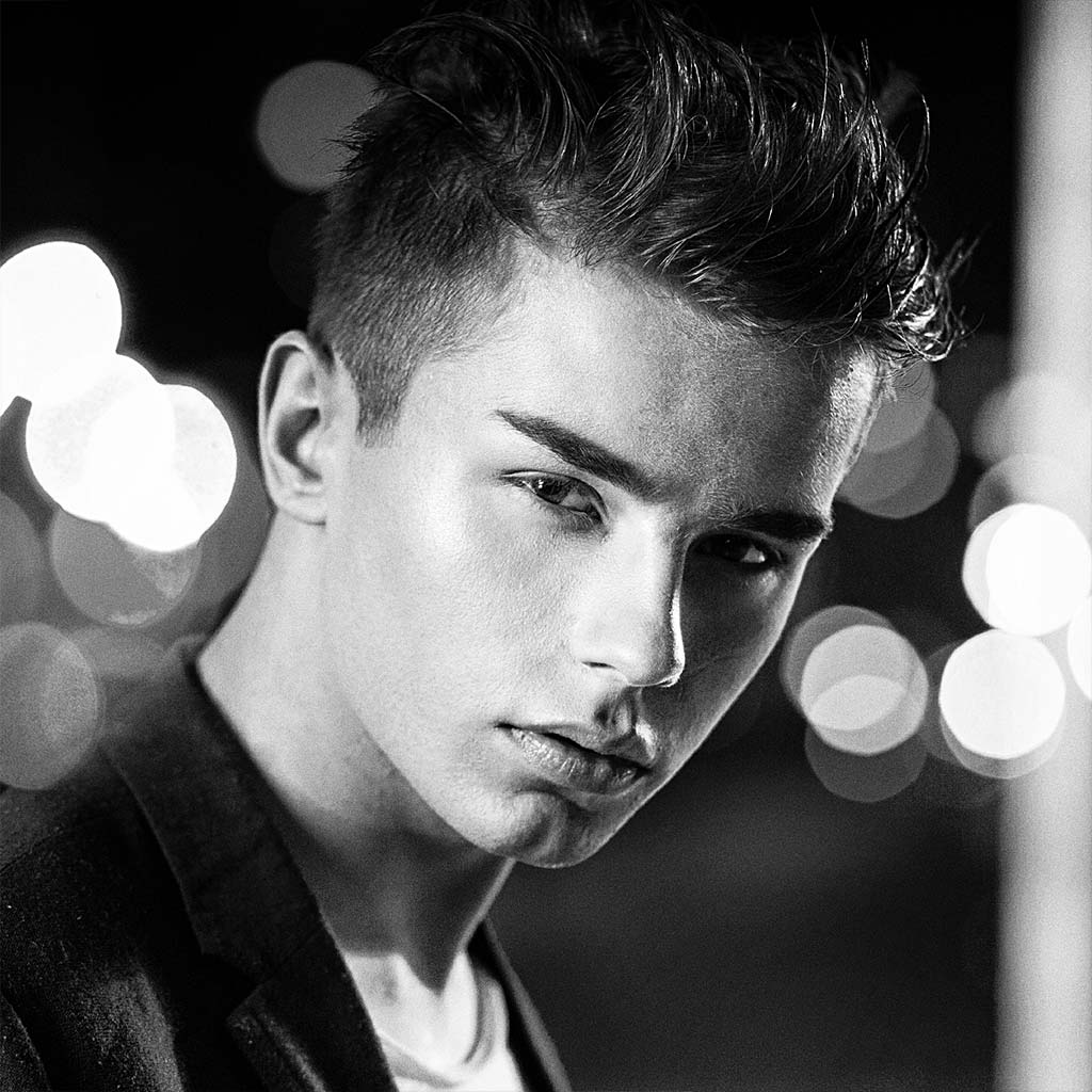 Image of man with cropped spikey,textured hair styled with low shine with Mojo Hair* Classic Pomade