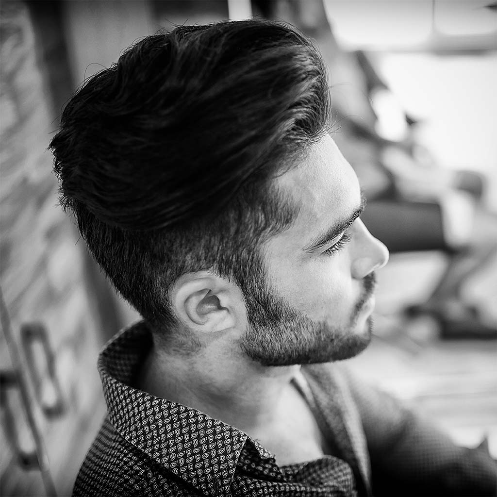 Male model with beard and under cut hairstyle Perfect your style with Mojo Hair* Classic Pomade